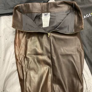 CHANEL leather skirts with golden buttons